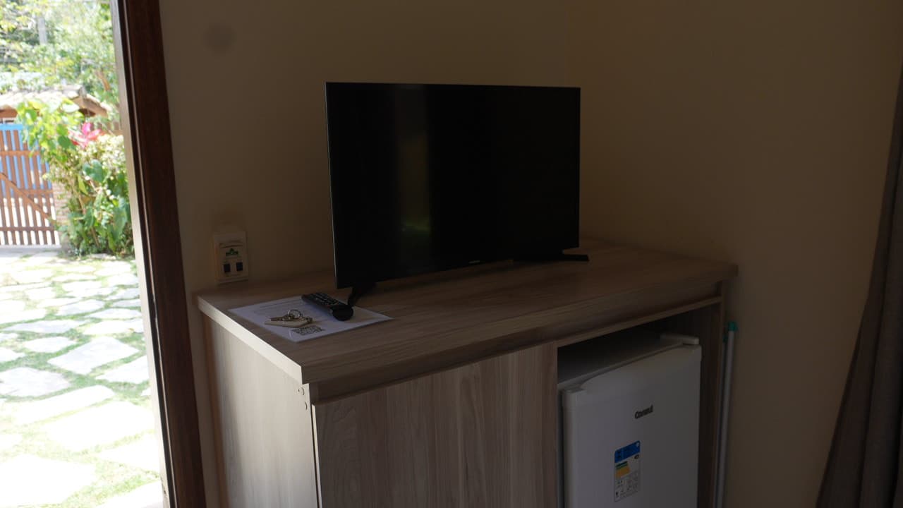 Quarto com TV e frigobar